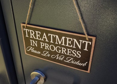 Sign on the door at Breanna’s Beauty Room indicating treatment in progress in Toormina, New South Wales, AU.