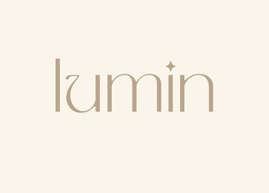 Elegant logo of Lumin Wellness + Beauty in Penryn, Cornwall, GB showcasing modern design.
