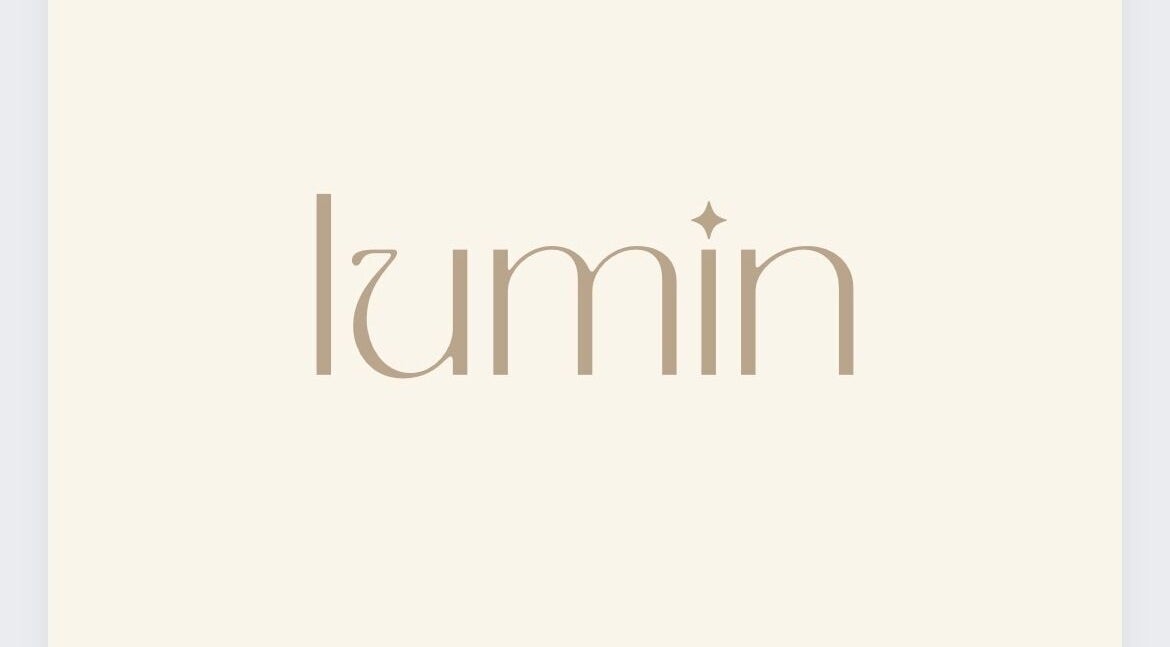 Elegant logo of Lumin Wellness + Beauty in Penryn, Cornwall, GB showcasing modern design.