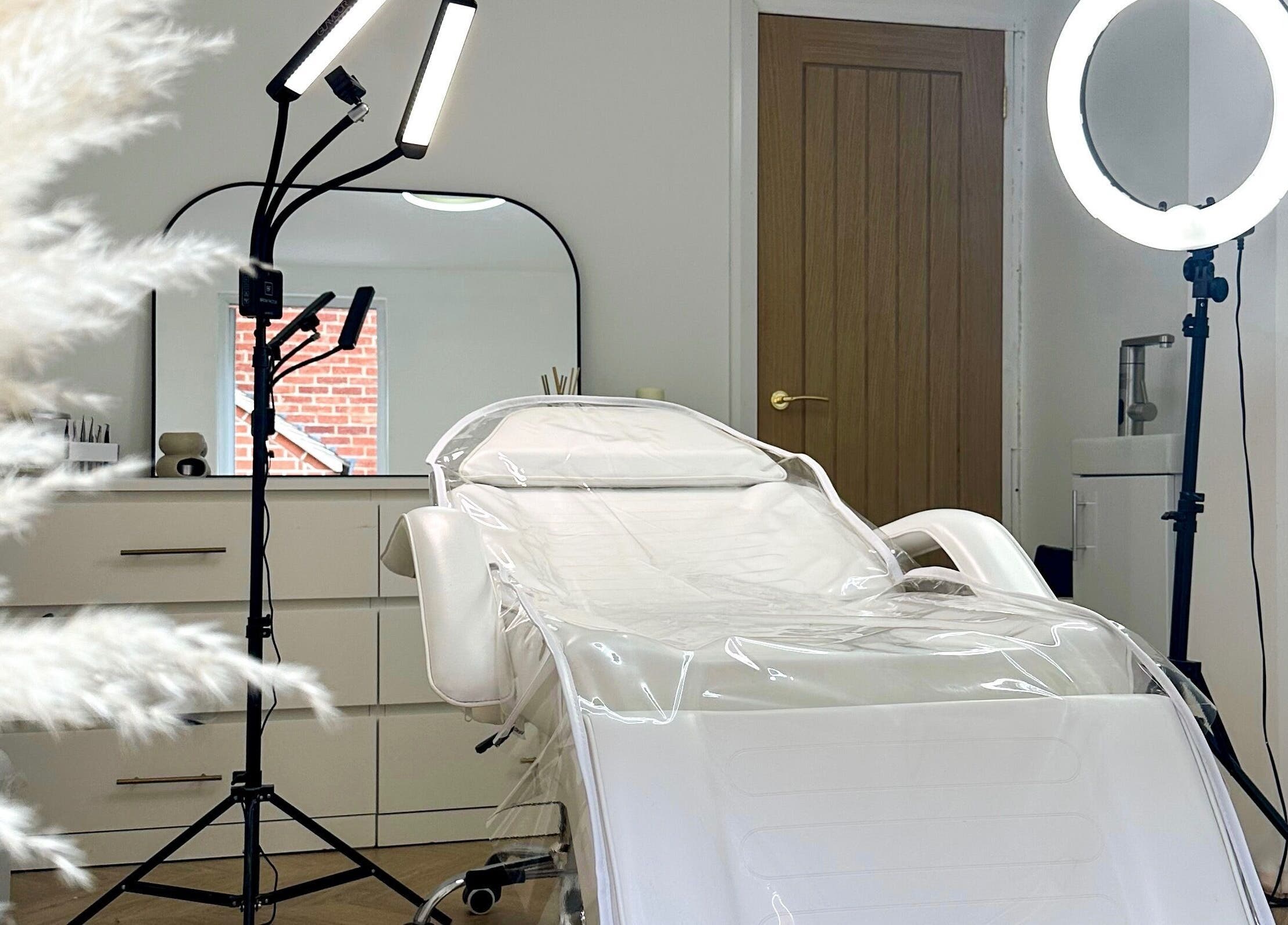 Elegant spa room at The Face Studio, Aston-on-trent, England, featuring a modern treatment chair and soft lighting.
