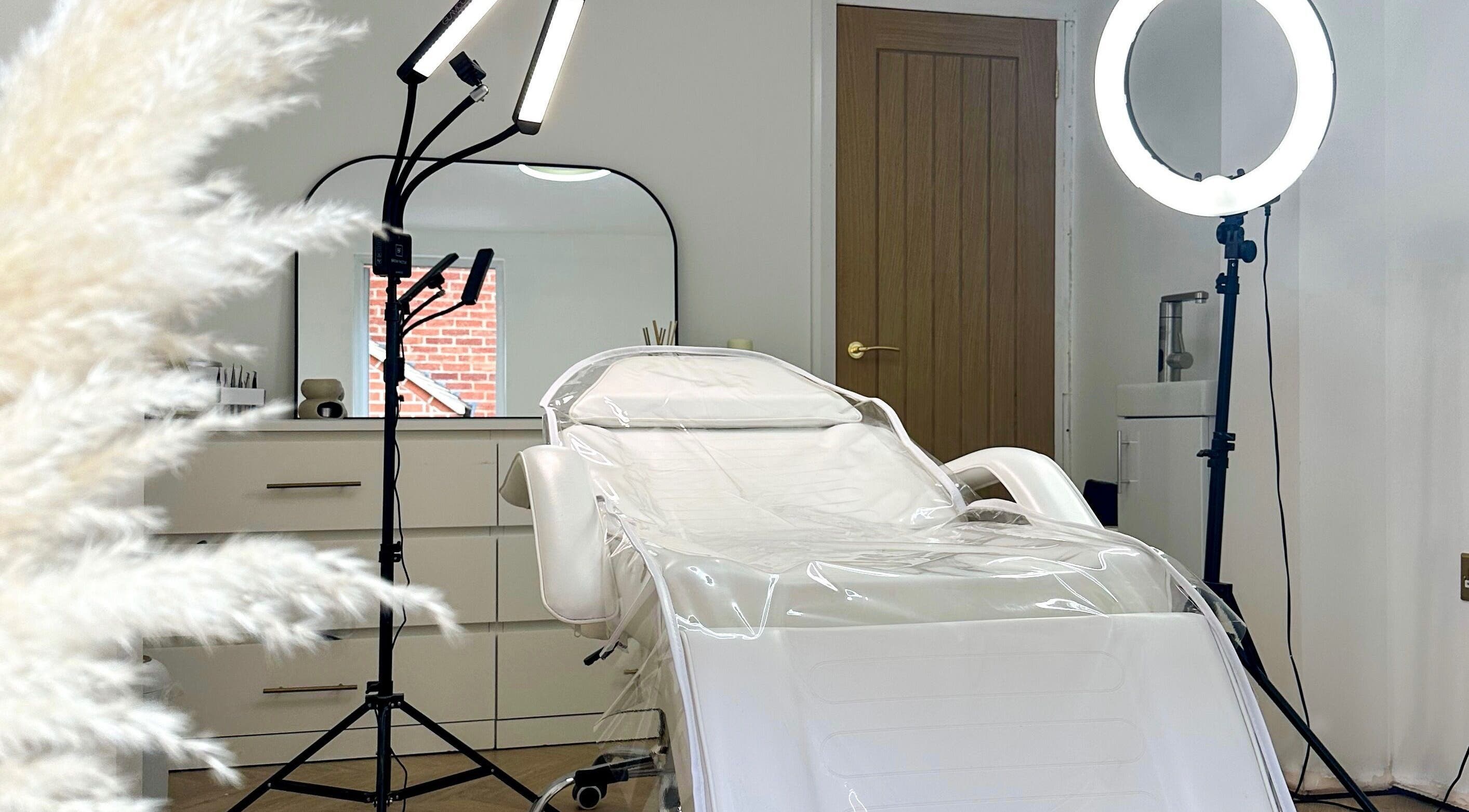 Elegant spa room at The Face Studio, Aston-on-trent, England, featuring a modern treatment chair and soft lighting.