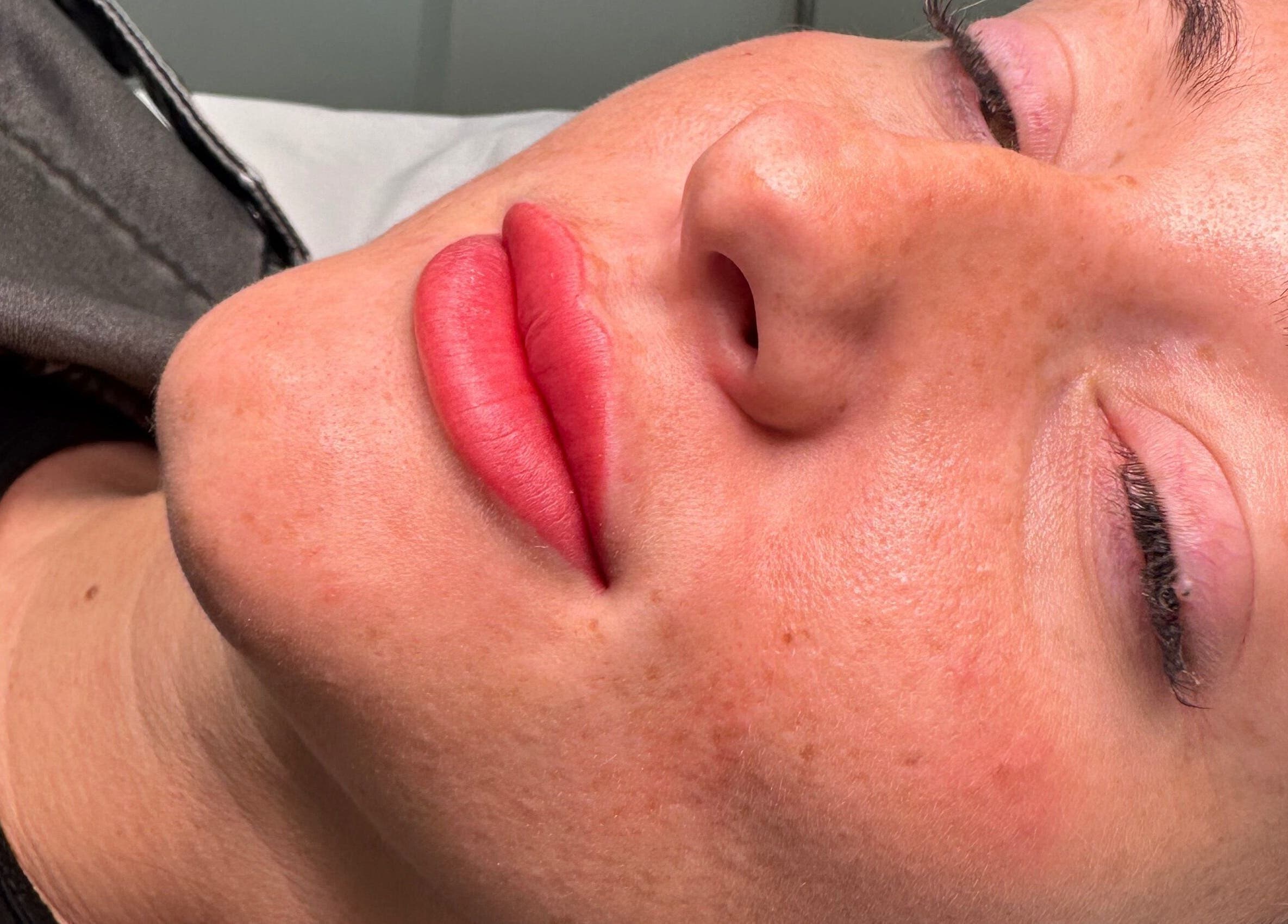 Close-up of lips after service at The Face Studio, Aston-on-trent, England, GB, showcasing vibrant red tone.