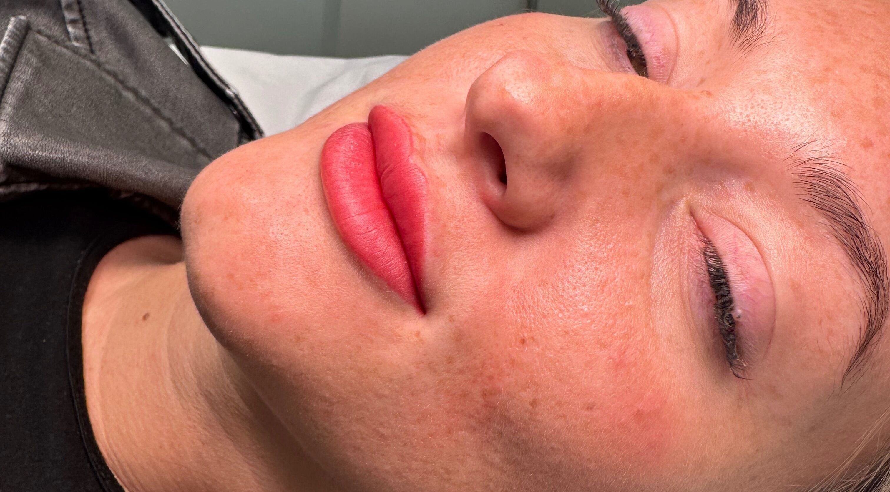 Close-up of lips after service at The Face Studio, Aston-on-trent, England, GB, showcasing vibrant red tone.