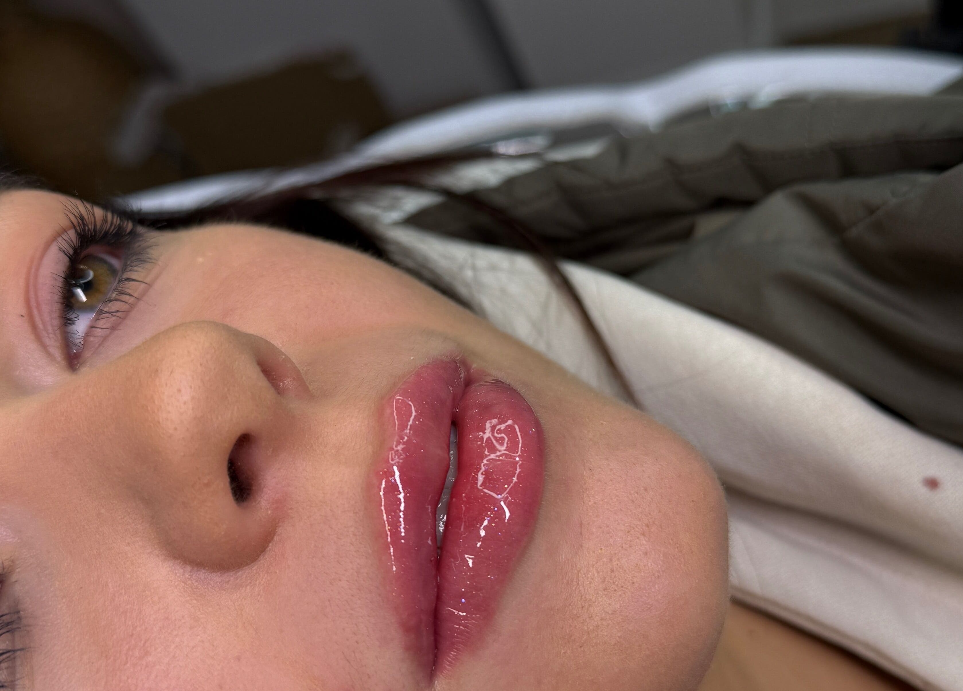 Close-up of glossy lips treatment at The Face Studio in Aston-on-Trent, England, GB.
