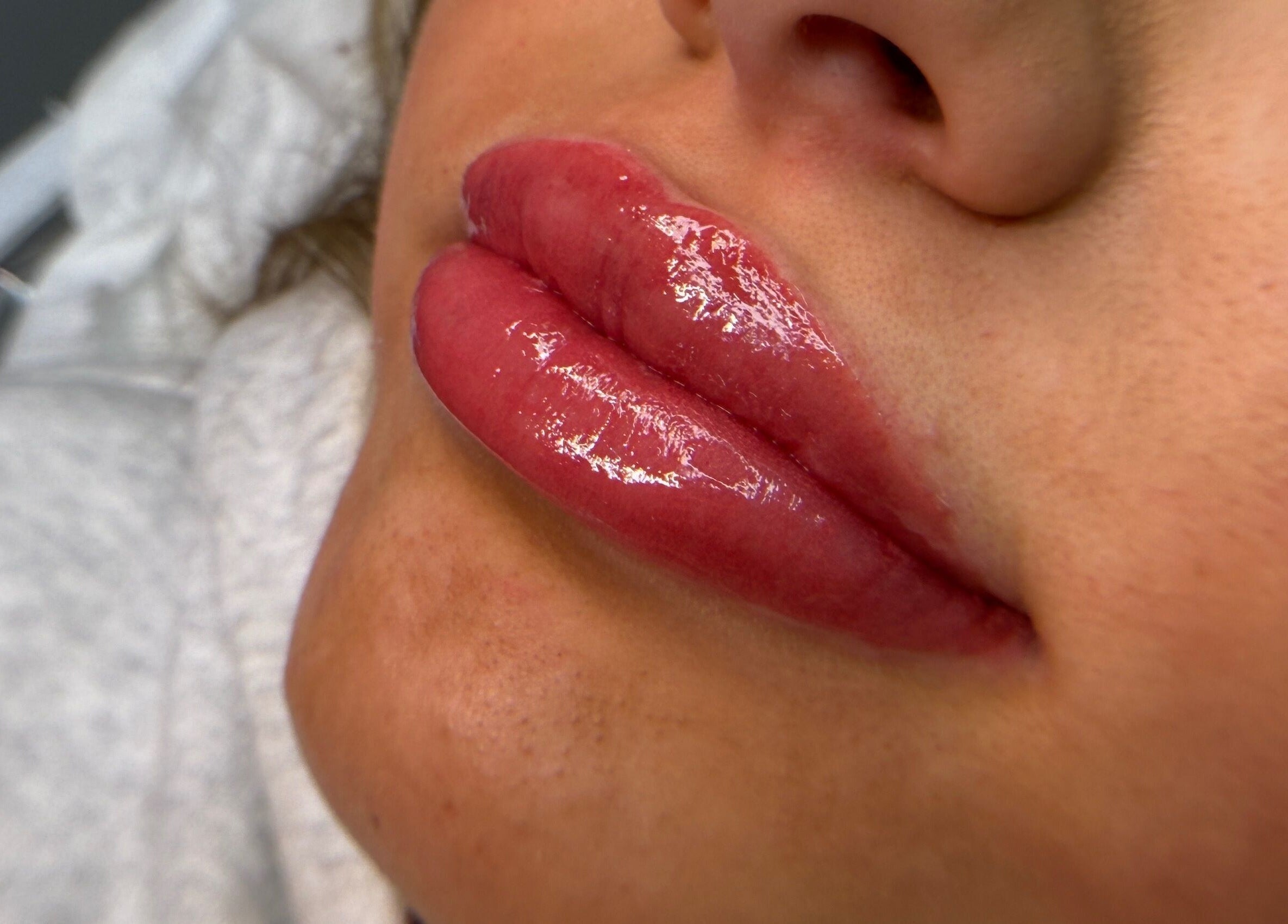 Glossy lips treatment at The Face Studio in Aston-on-trent, England, GB offers a luxurious glow.