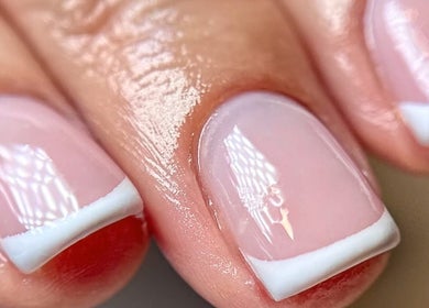Elegant French manicure at Aurora Beauty Cheshire, Congleton, England, GB showcasing glossy pink nails.