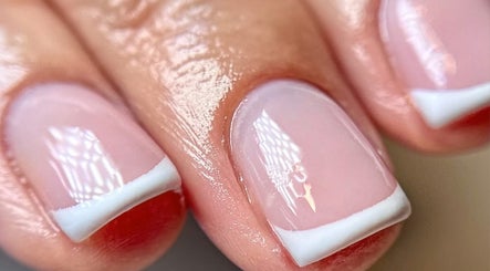 Elegant French manicure at Aurora Beauty Cheshire, Congleton, England, GB showcasing glossy pink nails.