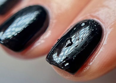 Close-up of glossy black nails at Aurora Beauty Cheshire in Congleton, England, GB.