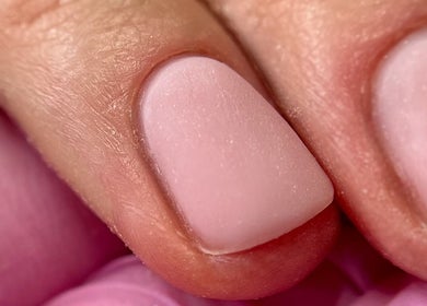 Close-up of chic pink manicured nail at Aurora Beauty Cheshire, Congleton, England, GB.