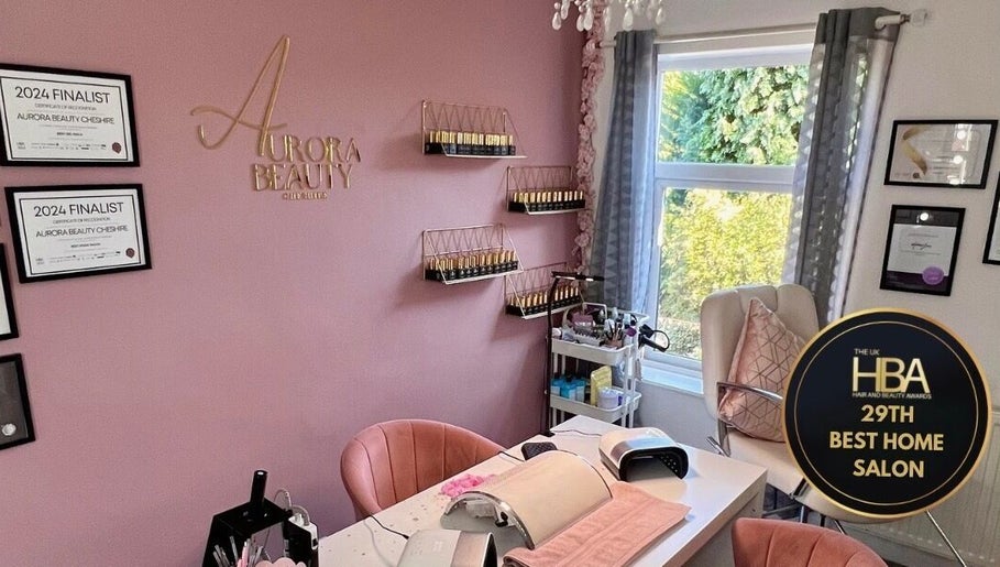 Elegant interior of Aurora Beauty Cheshire salon in Congleton, England, showcasing awards and modern decor.