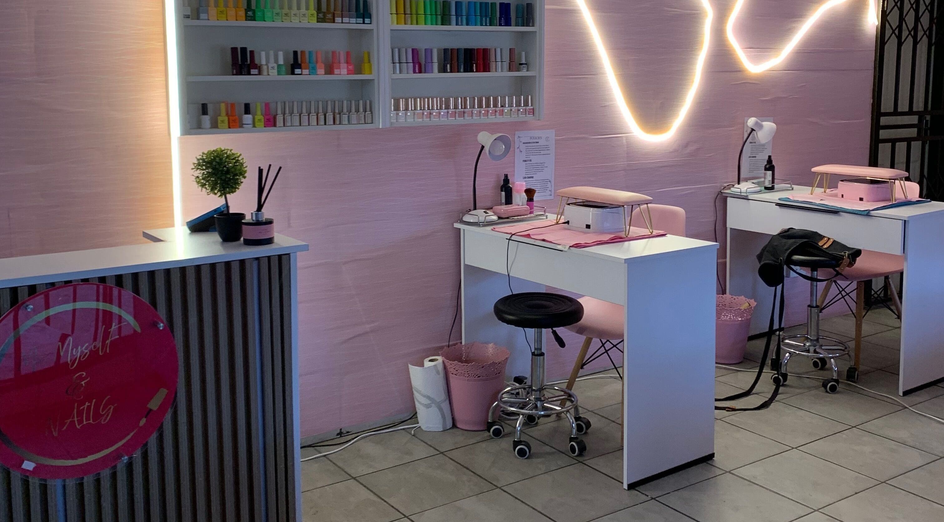 Stylish interior of Me Myself And Nails in Soweto, Gauteng, ZA with nail polishes and modern decor.