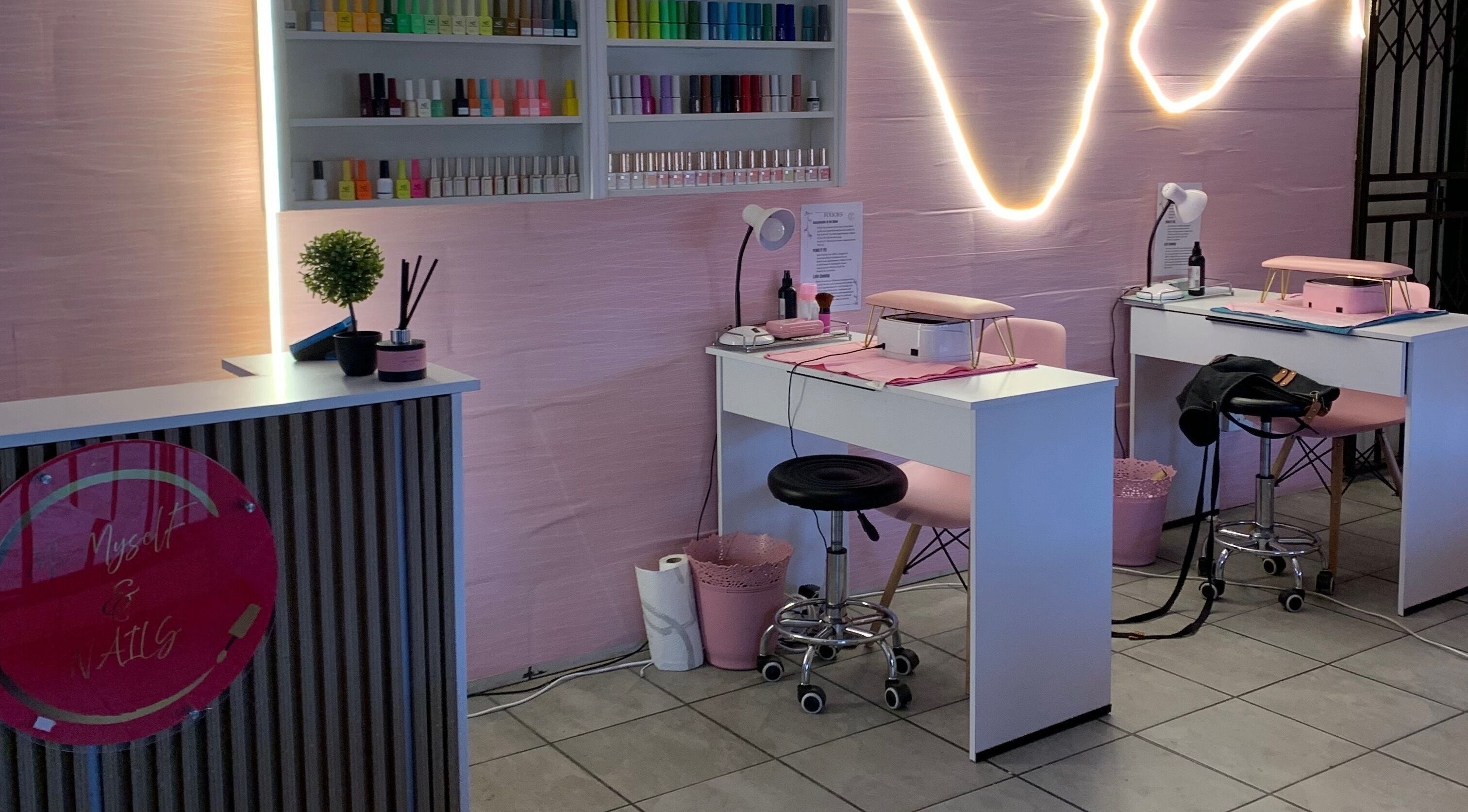 Stylish interior of Me Myself And Nails in Soweto, Gauteng, ZA with nail polishes and modern decor.