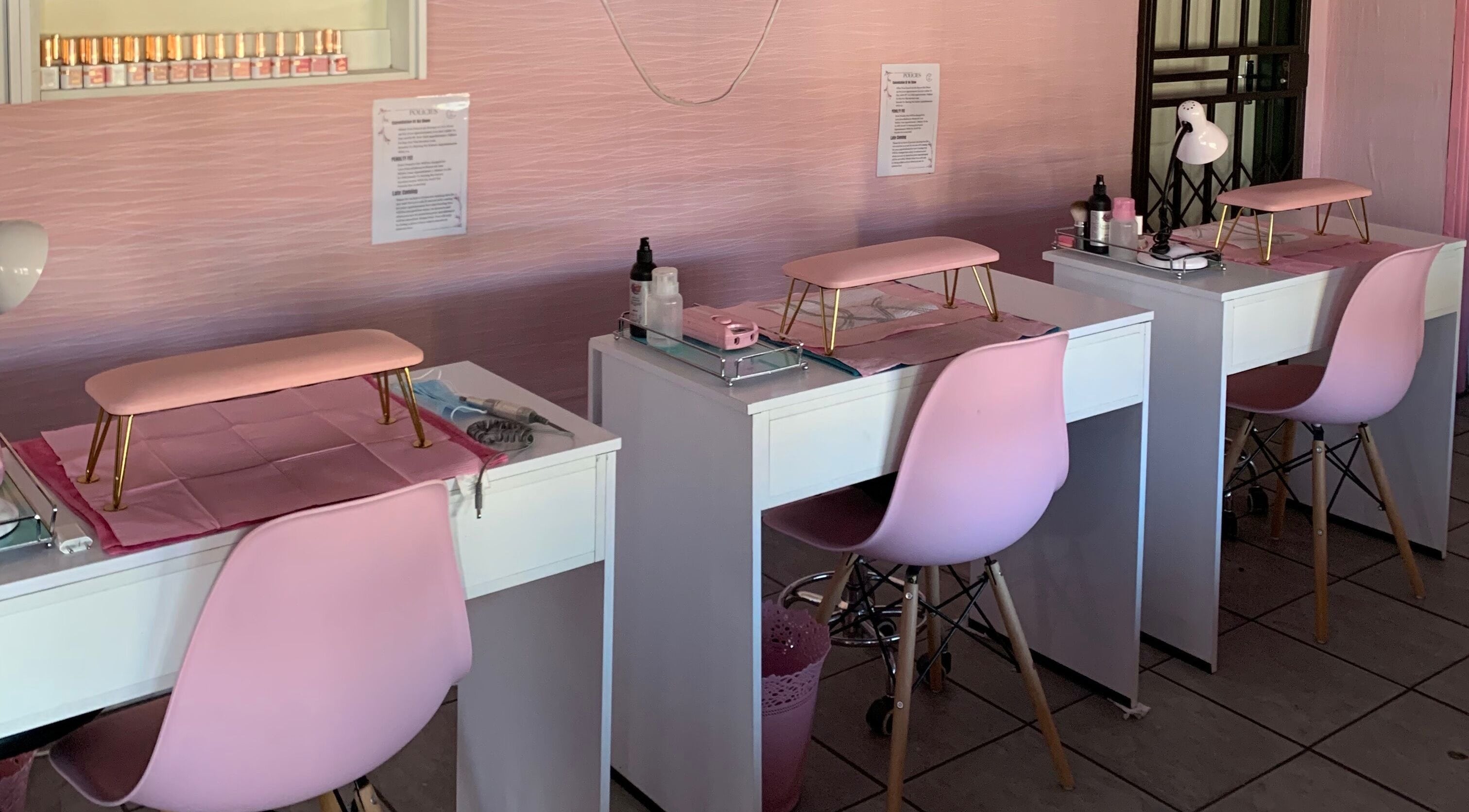 Chic nail salon setup at Me Myself And Nails in Soweto, Gauteng, ZA featuring pink decor and modern furniture.