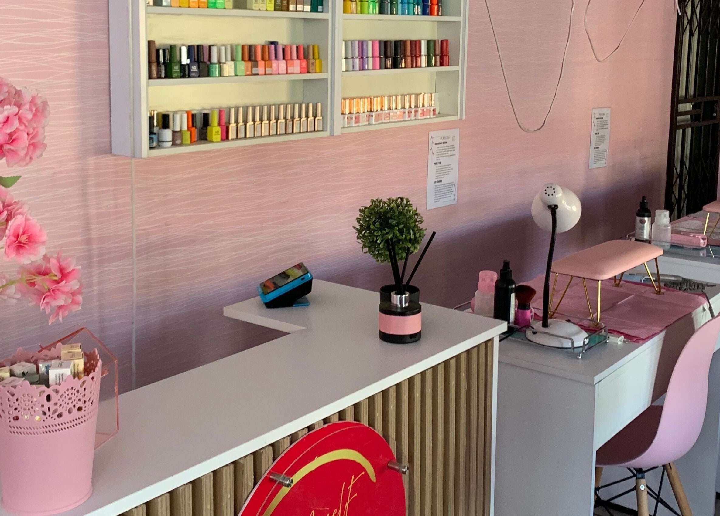 Modern nail salon setup at Me Myself And Nails in Soweto, Gauteng, ZA with elegant decor and polish collection.