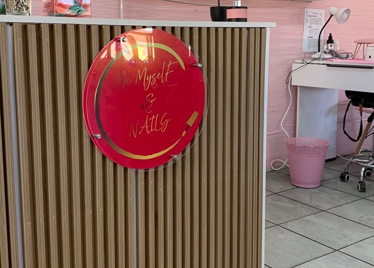Reception and nail desk at Me Myself And Nails, Soweto, Gauteng, ZA with pink decor and modern design.