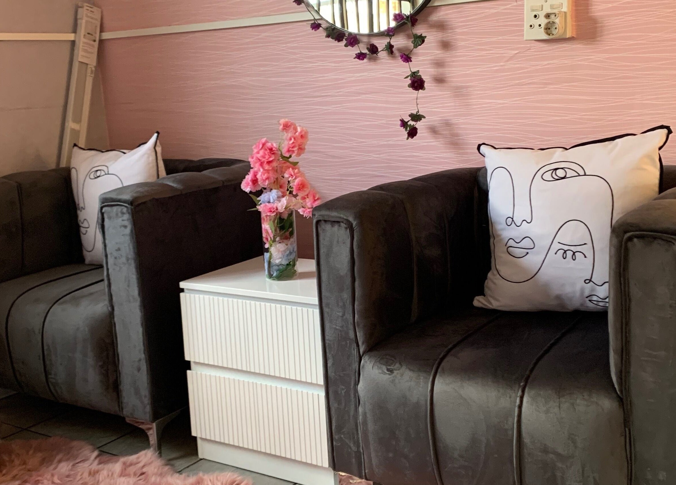 Comfortable seating at Me Myself And Nails, Soweto, Gauteng, ZA with plush sofas and artistic decor.