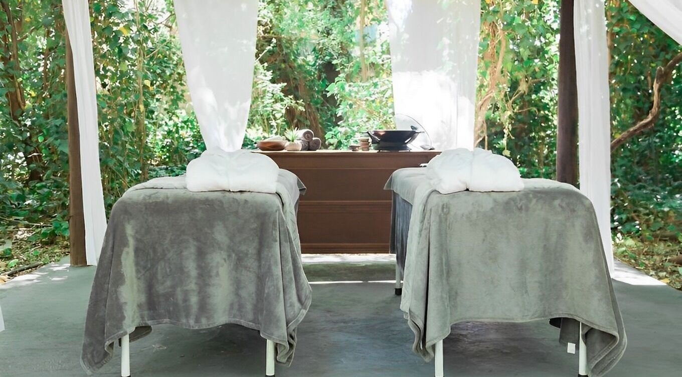 Relaxing outdoor spa setup at Beauty Unique Outdoor Day Spa Potchefstroom, Potchefstroom, ZA. Tranquil green surroundings.