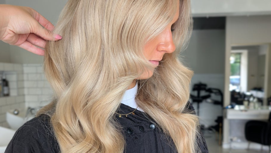 Blonde hair styled in soft waves at Hair by Karina Brown in Leeds, England, GB.