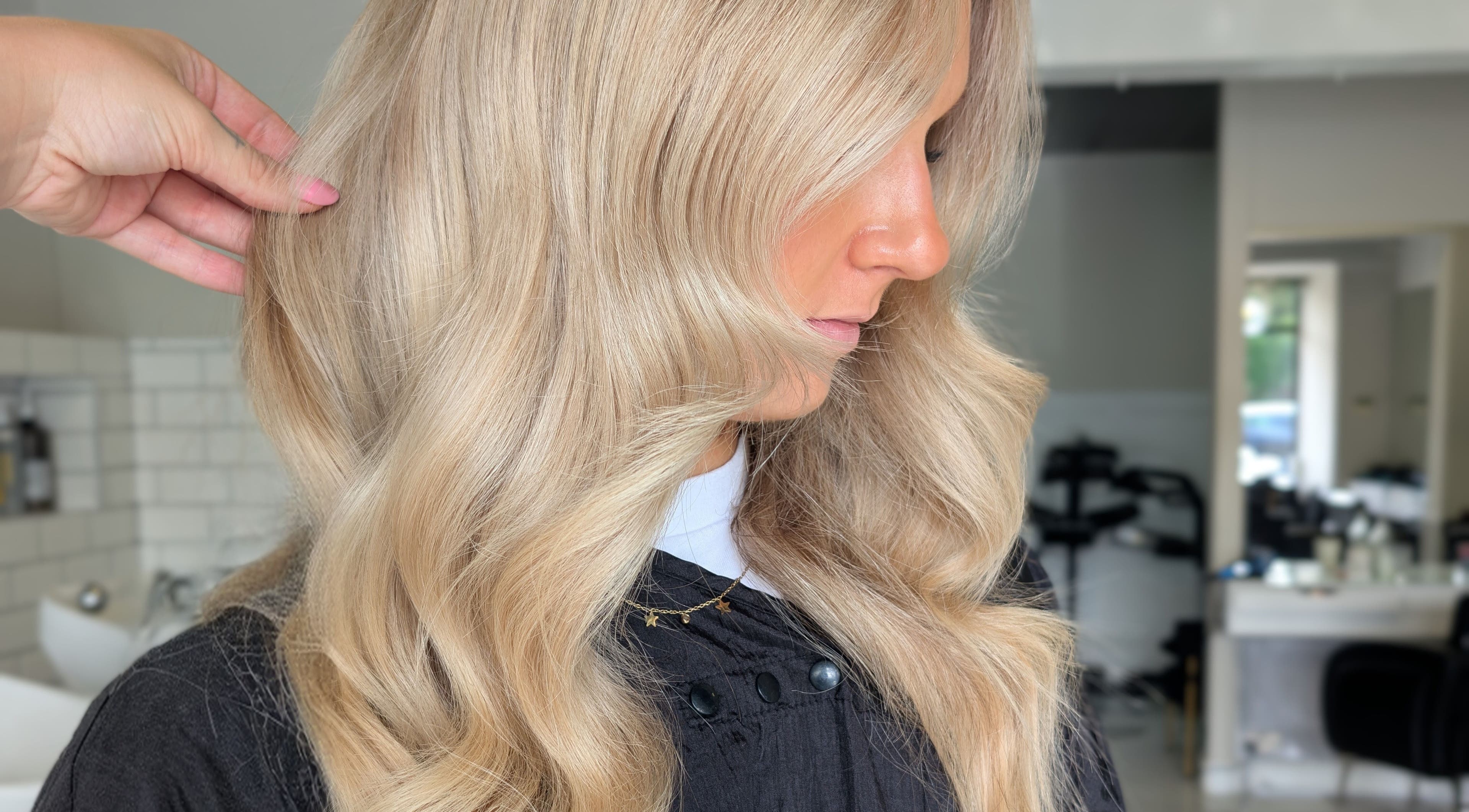 Blonde hair styled in soft waves at Hair by Karina Brown in Leeds, England, GB.