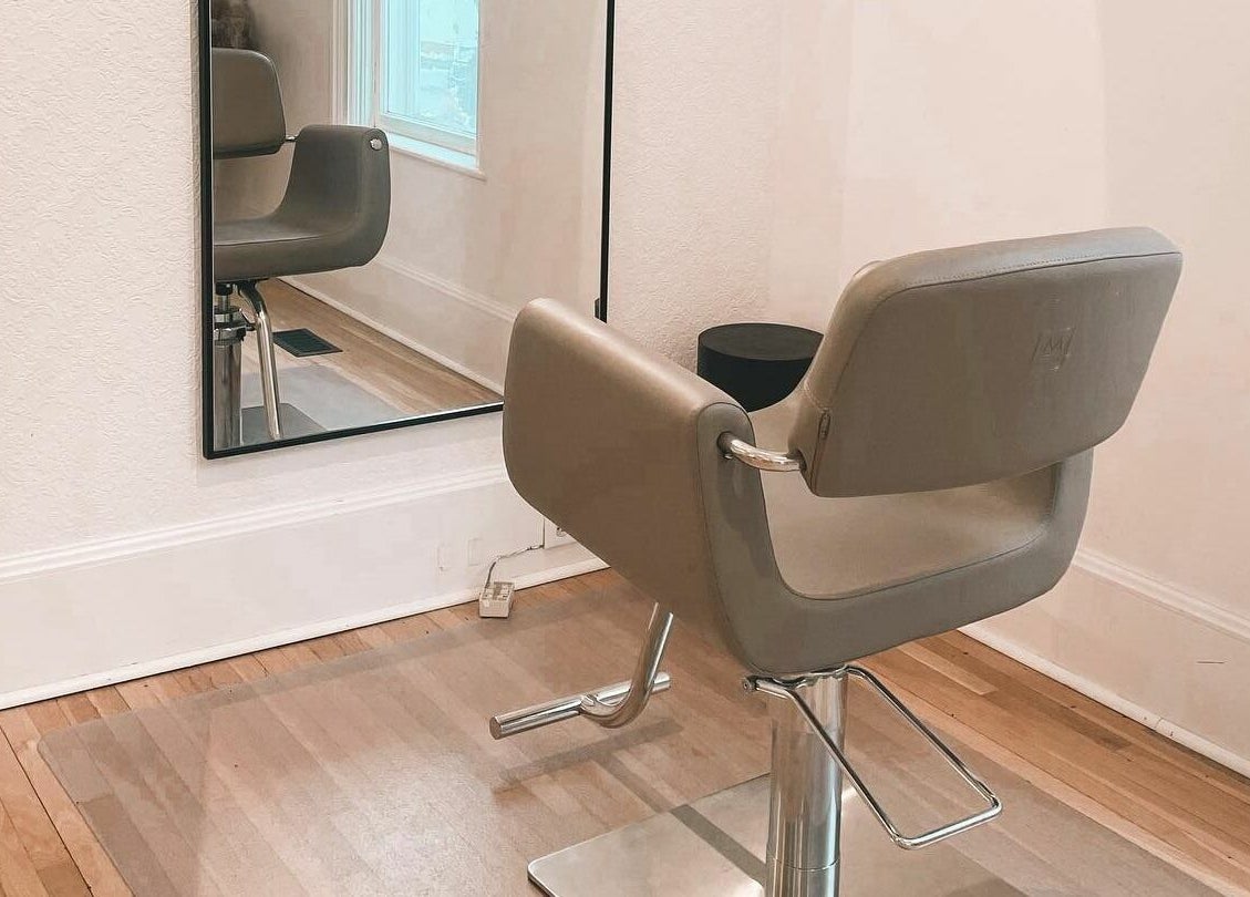 Elegant styling chair and mirror setup at Odette Hair Studio, Prince Edward, Ontario, CA.