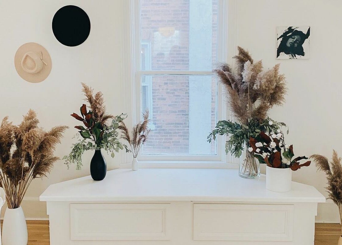 Elegant decor at Odette Hair Studio, Prince Edward, Ontario, CA, featuring pampas grass and modern vases.