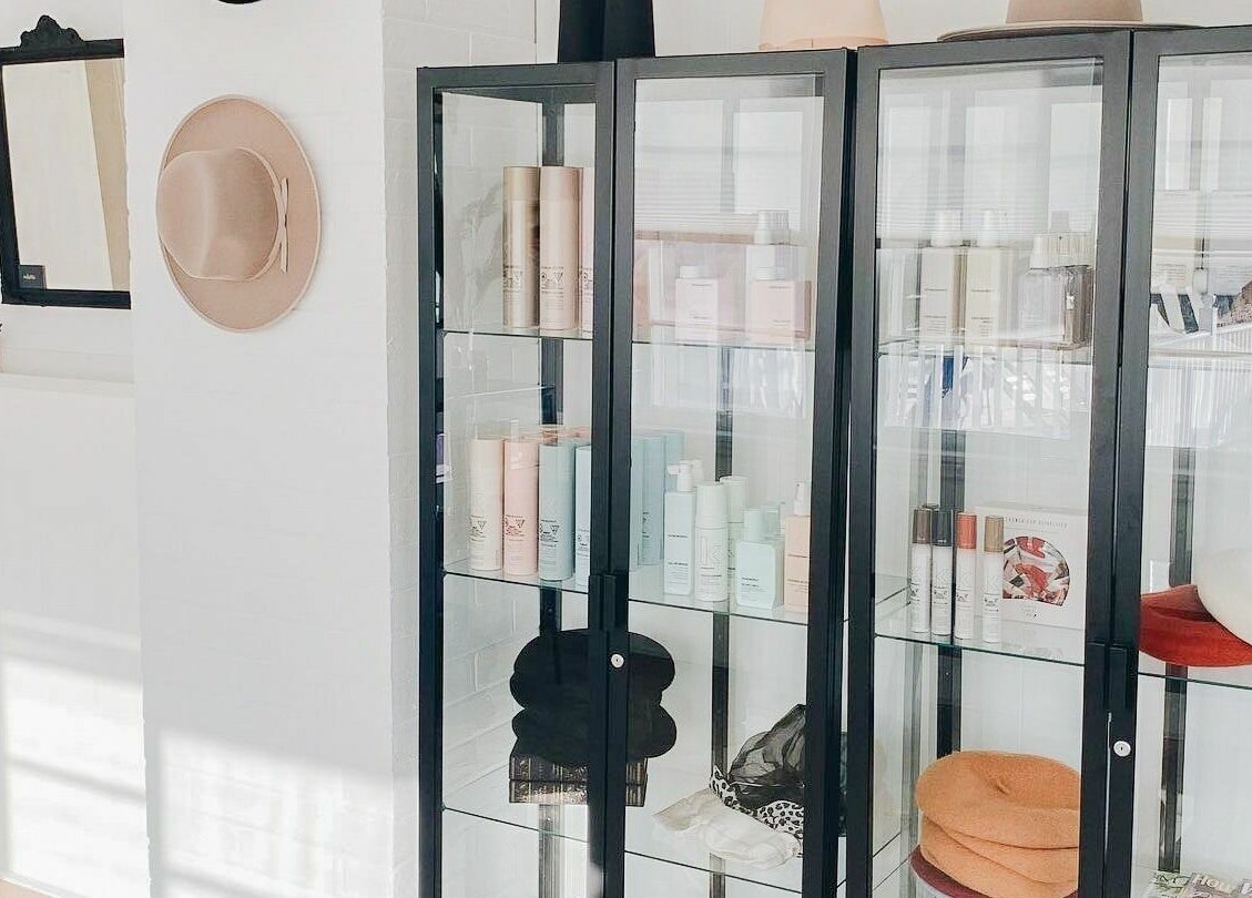 Odette Hair Studio product display in Prince Edward, Ontario, CA featuring elegant hair care items.