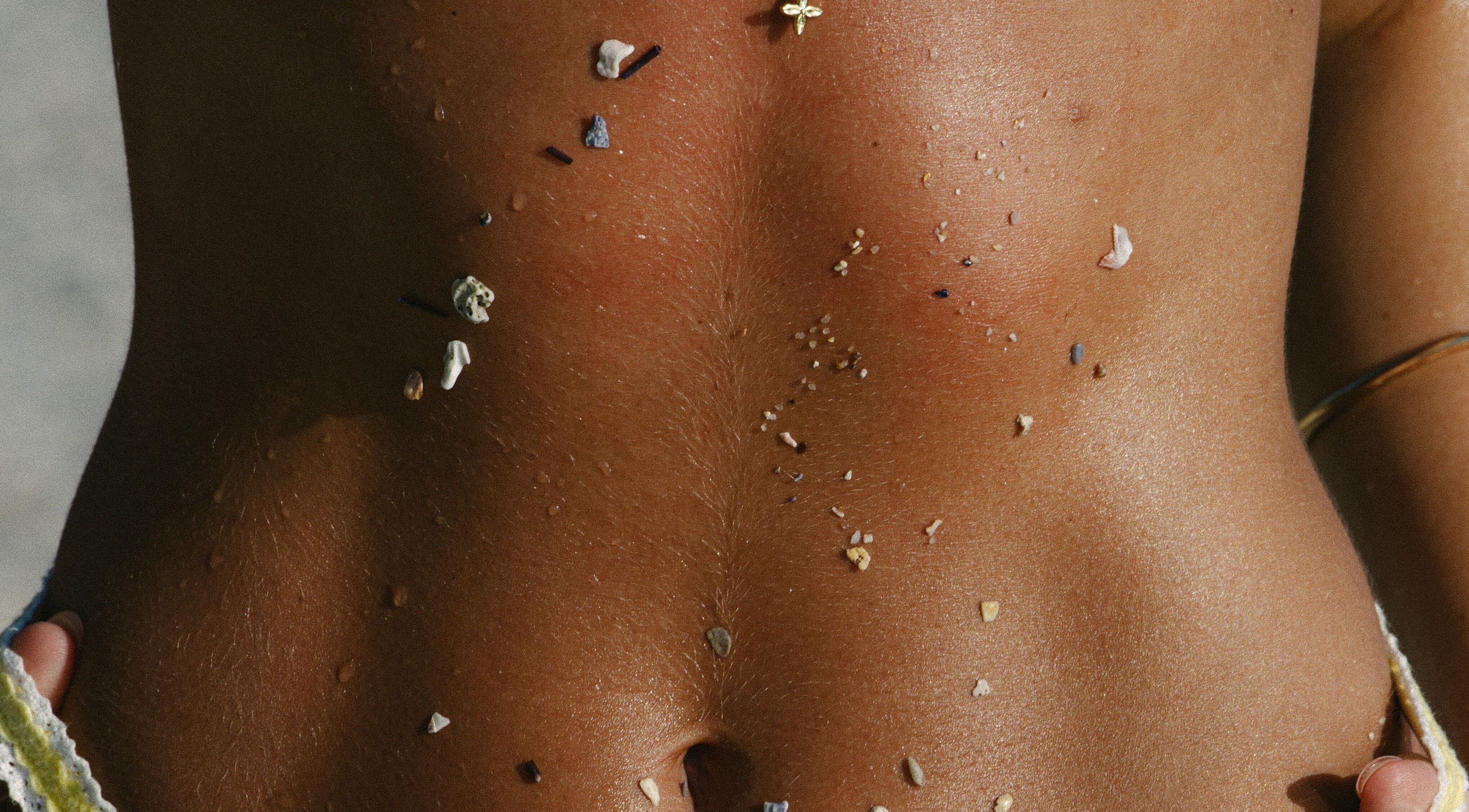 Sun-kissed skin with seashell accents at Leveche Tanning & Beauty in Chedgrave, England, GB.