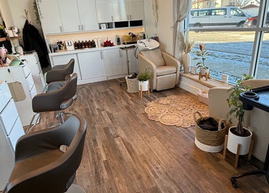 Bright, modern salon interior at Hair by Laura Pierini in Massapequa, New York, US, featuring stylish decor.