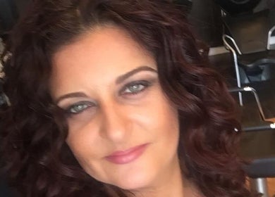 Inside Hair by Laura Pierini, Massapequa, New York, with elegant salon chairs and stylish decor.