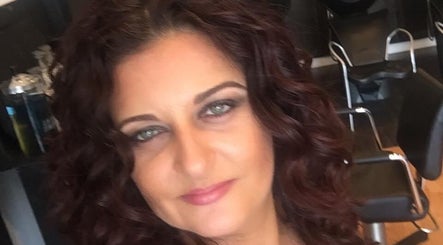 Inside Hair by Laura Pierini, Massapequa, New York, with elegant salon chairs and stylish decor.