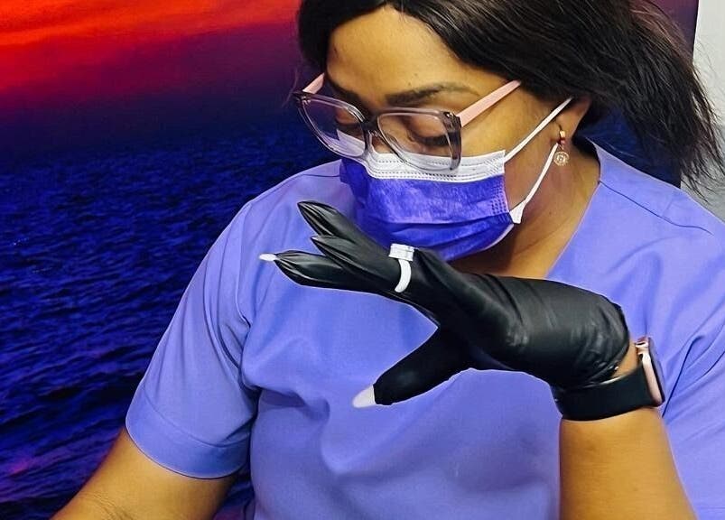 Beauty technician at Moois Beauty Lash and Brow Bar, Johannesburg, Gauteng, ZA, preparing for a service.