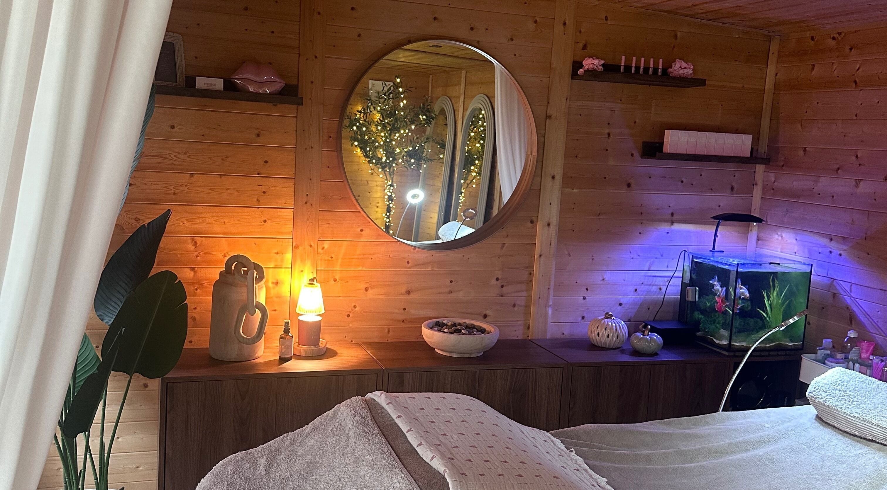 Cozy wellness room at By Georgie, Kenilworth, England, GB with warm lighting and decor.