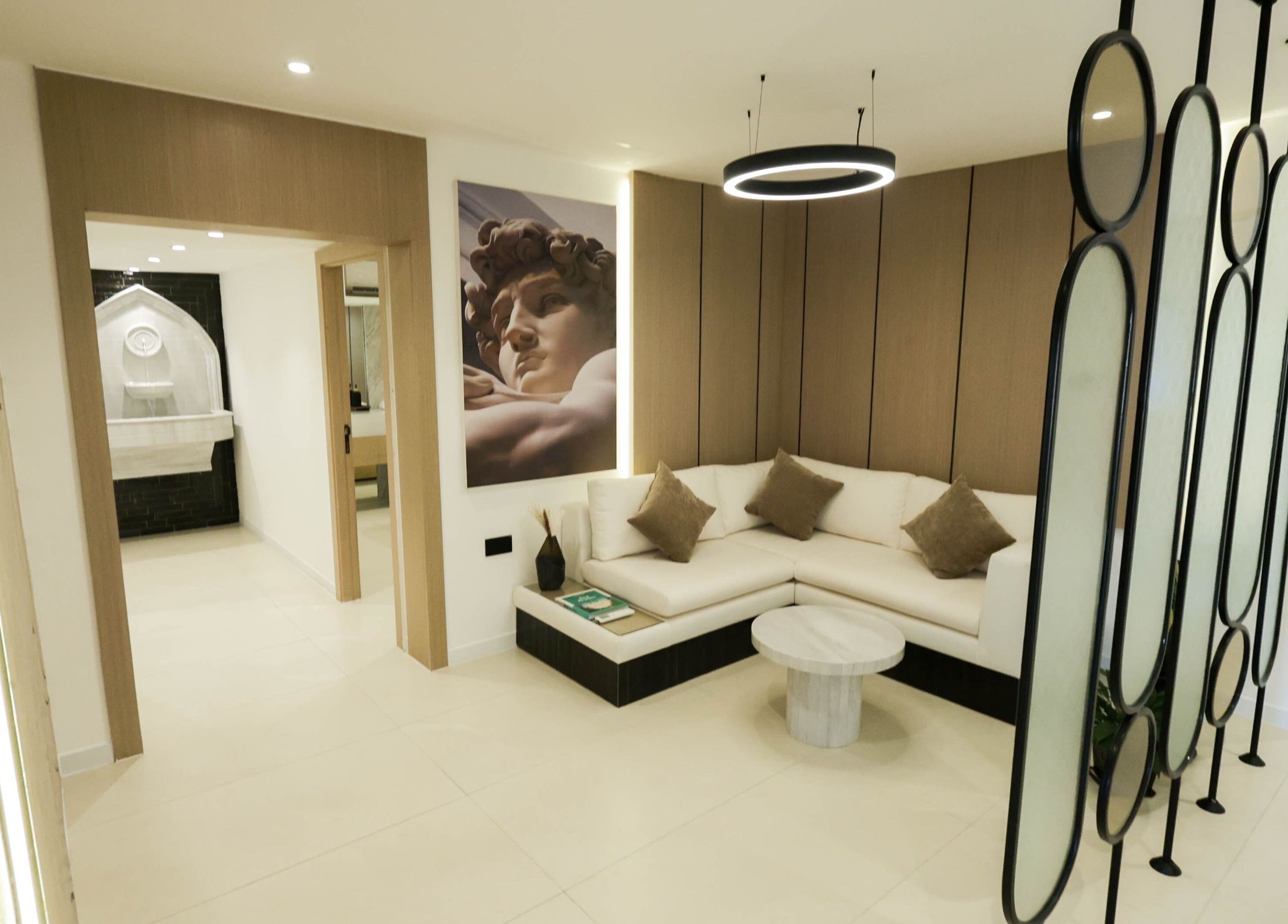 Stylish lounge area at Antibes Salon Riffa in Riffa, BH, featuring modern decor and cozy seating.