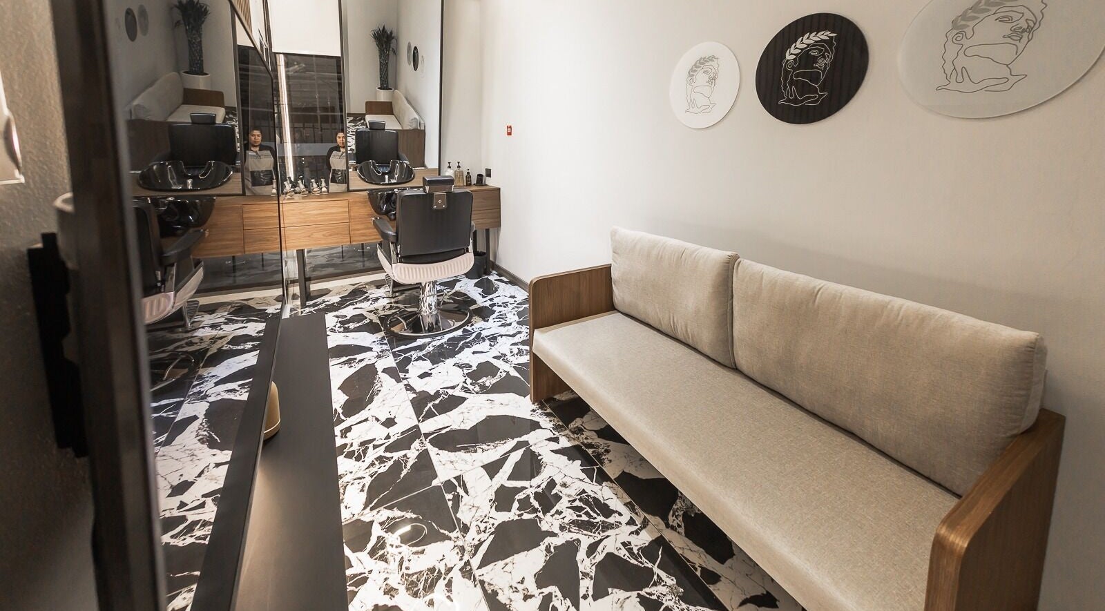 Modern interior of Antibes Salon Seef in Manama, BH, featuring stylish furnishings and elegant decor.