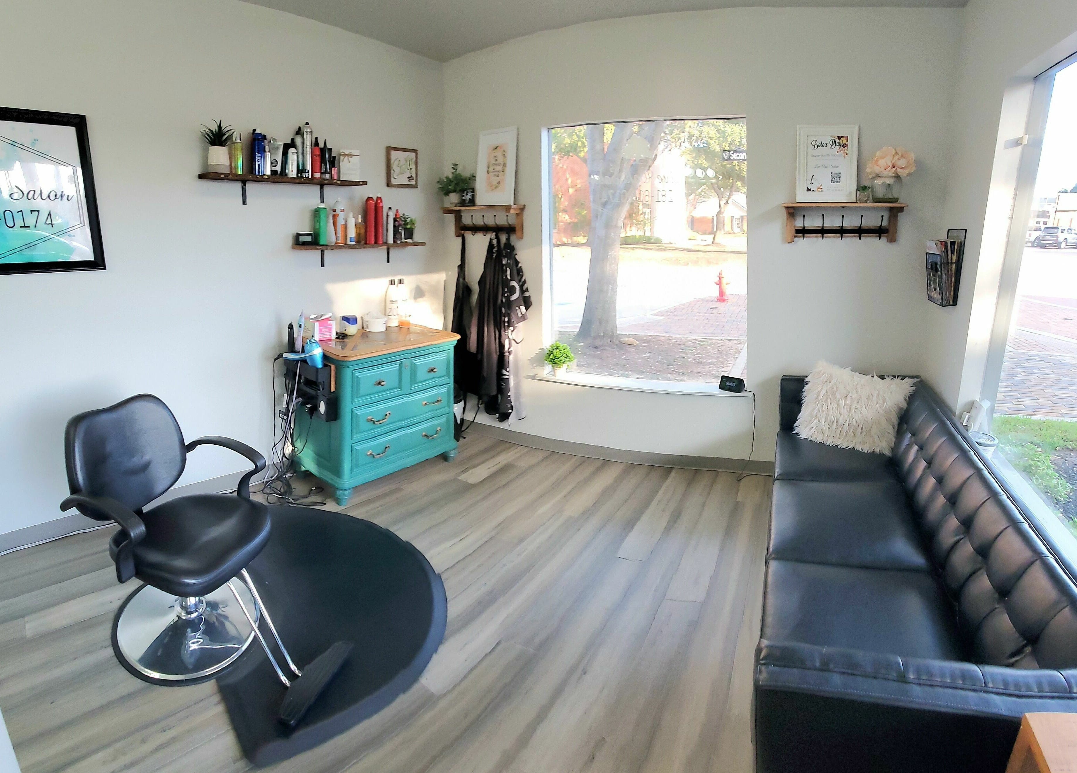 Cozy interior of Live Oak Salon with styling station in Katy, Texas, US, highlighting elegant decor.