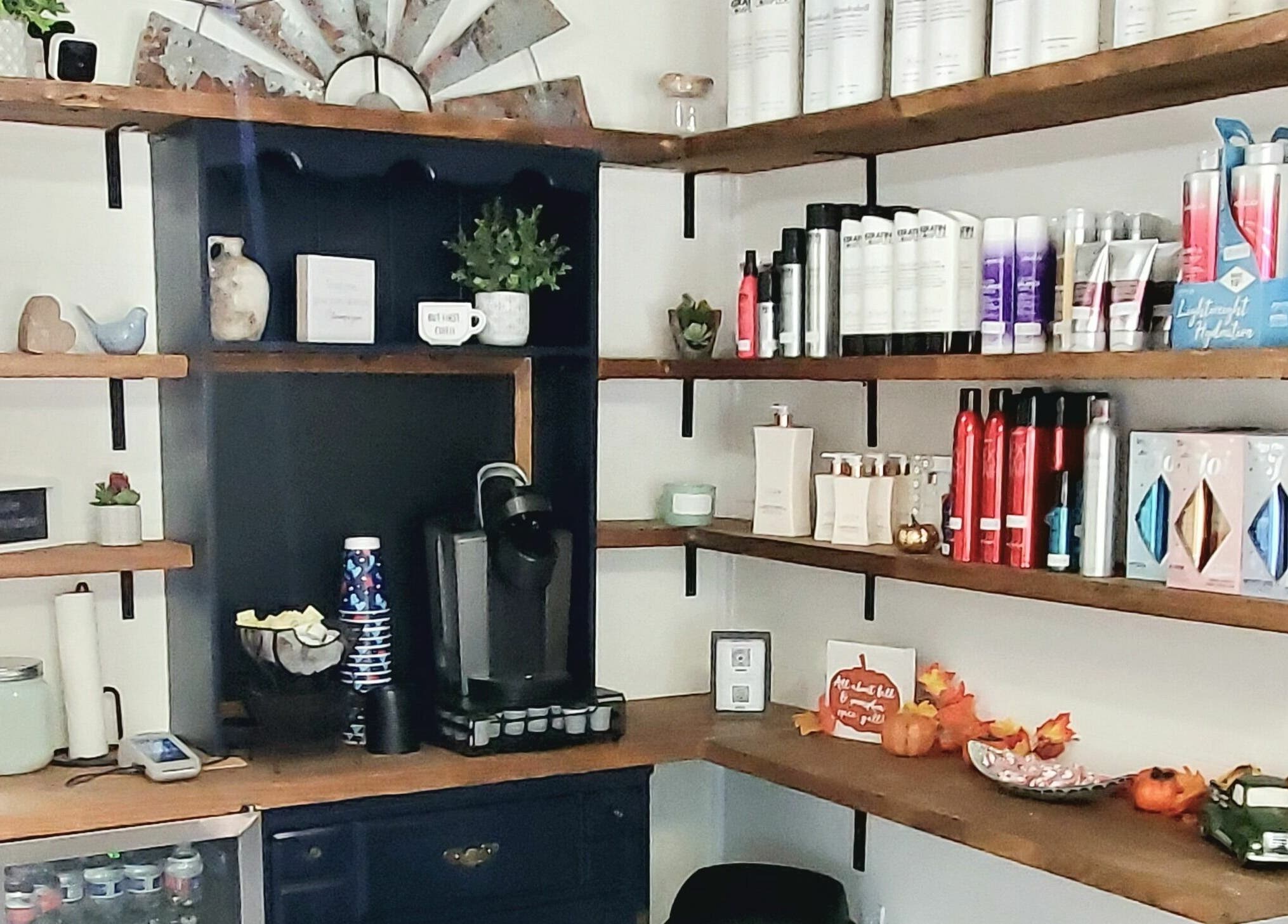 Elegant product display shelves at Live Oak Salon in Katy, Texas, US showcasing hair and beauty essentials.