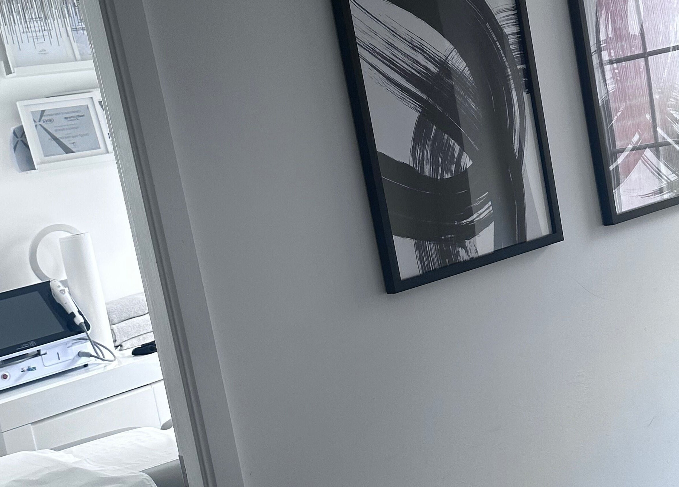 Sleek, modern clinic interior at Rebecca Beards Clinic, Bridgend, Wales, showcasing stylish decor and equipment.