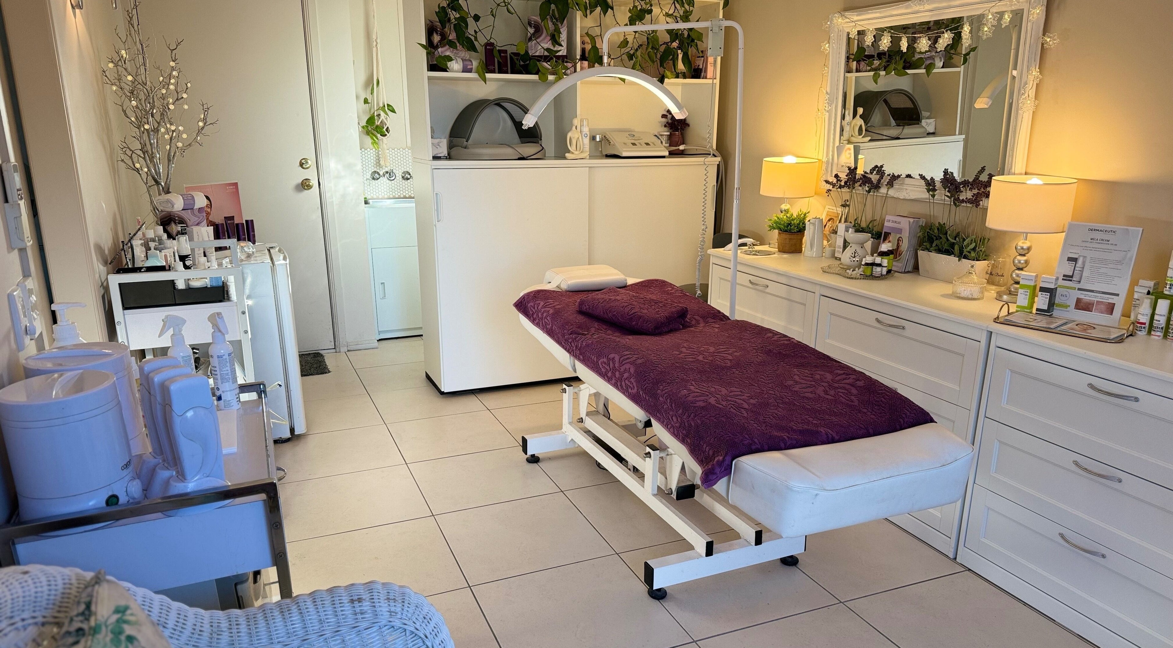 Relaxing treatment room at Beauty in the ‘Burbs, Benowa, Queensland, AU, featuring a cozy ambience.