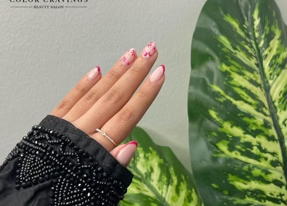 Delicate floral nail art at Color Cravings Beauty Salon, Bu Quwah, Northern Governorate, BH.