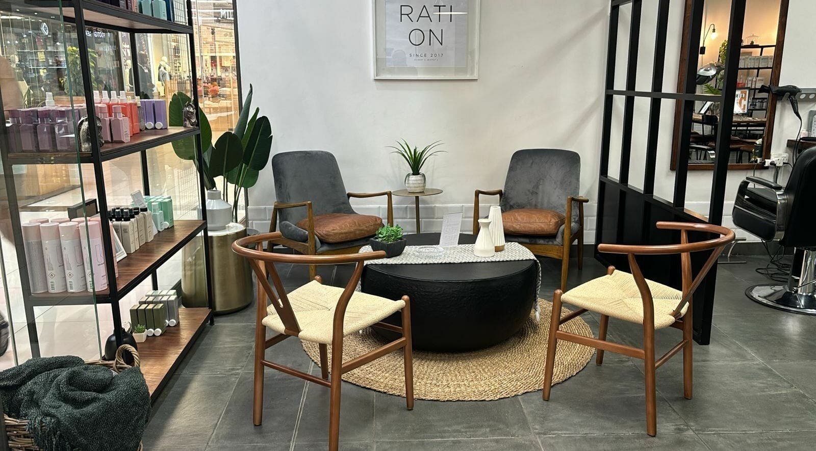 Modern seating area at The Federation Kyalami, Midrand, Gauteng, ZA, featuring stylish chairs and decor.