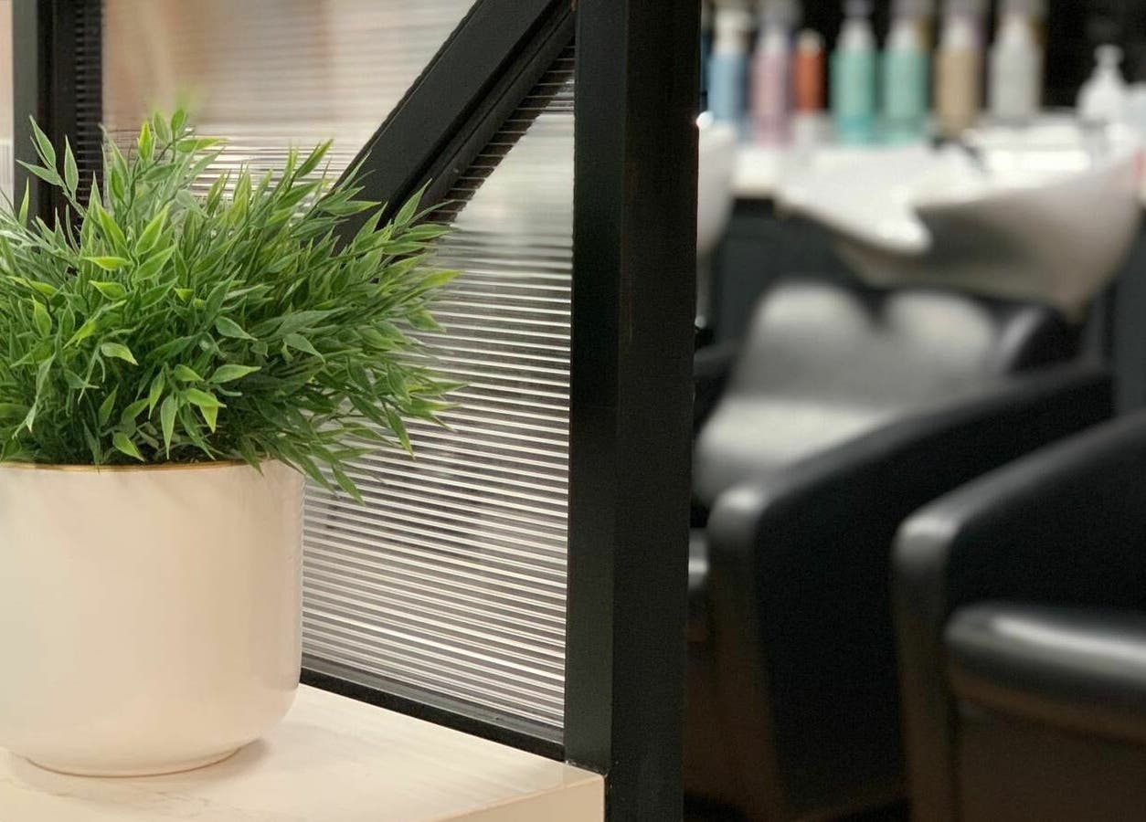 Green plant in white pot adds serenity at The Federation Kyalami salon, Midrand, Gauteng, ZA.