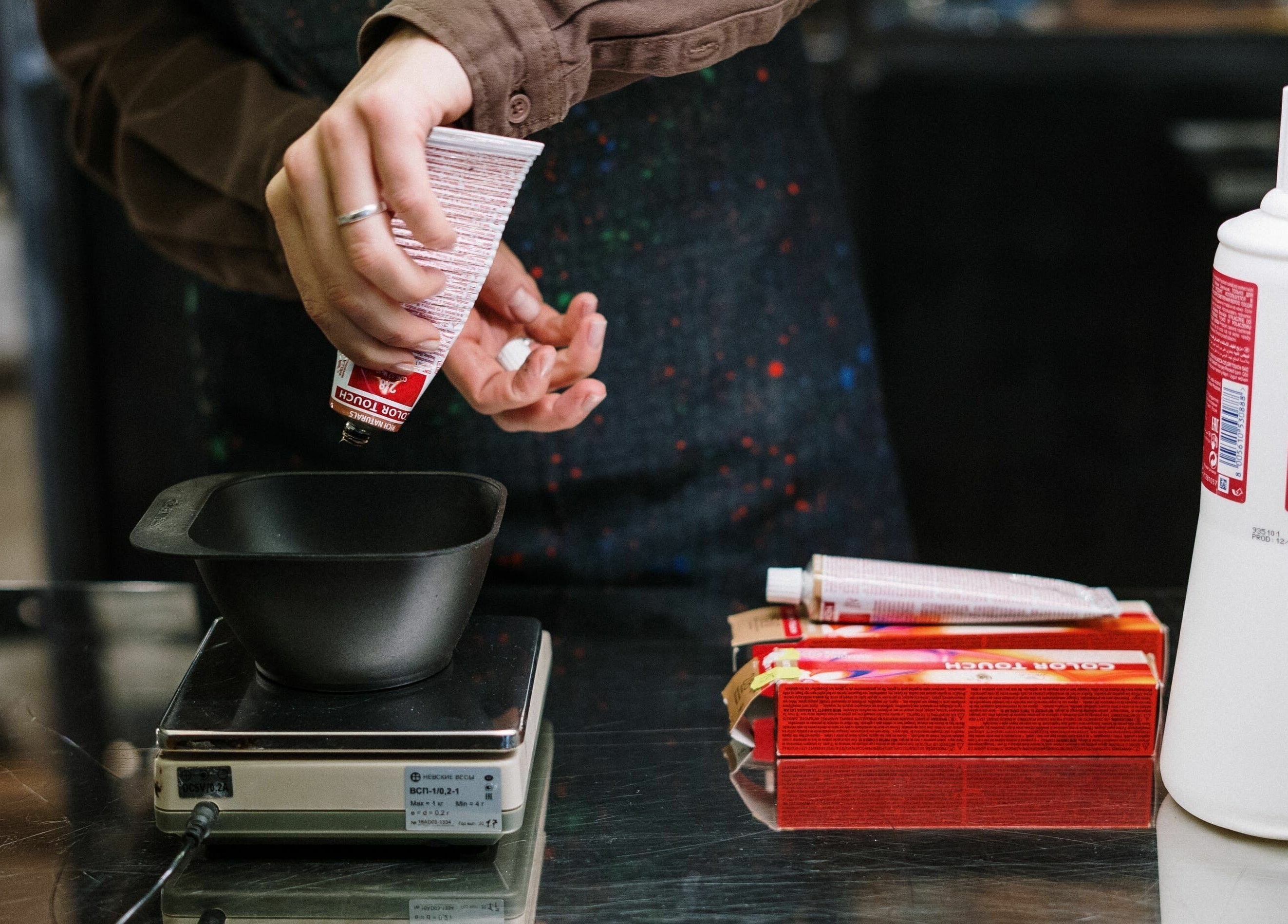 Hair color mixing at The Federation Kyalami in Midrand, Gauteng, ZA, highlighting salon expertise.