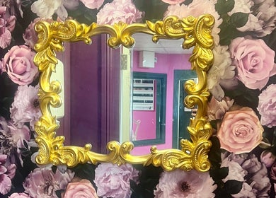 Elegant gold-framed mirror with floral background at Blossom Beauty, Abbeyleix, County Laois, IE.