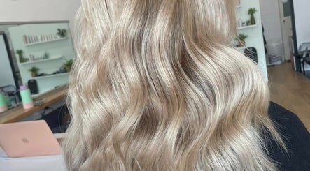 Stylish blonde waves at Malia Hair and Beauty Boutique in Hastings, Victoria, AU.