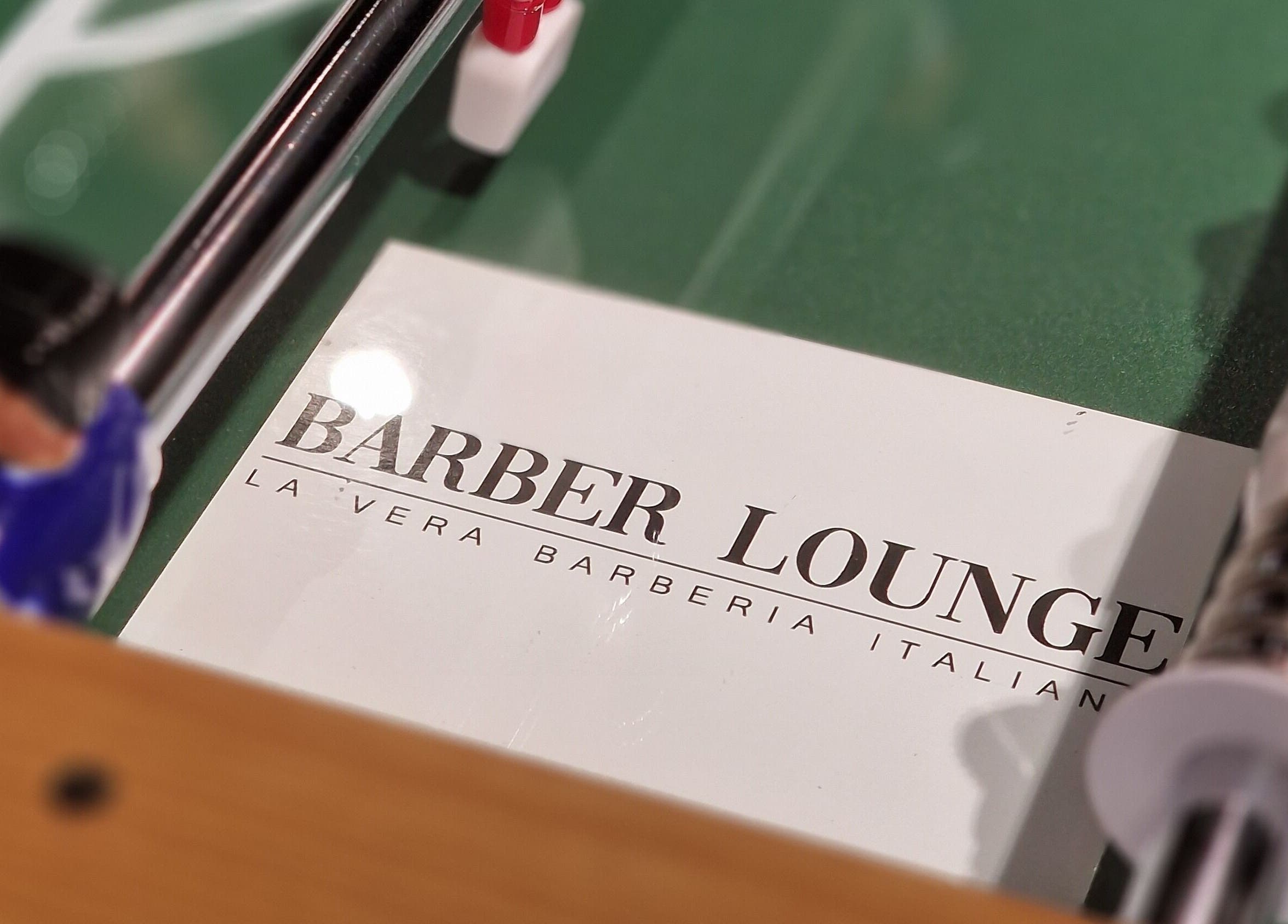 Gioco del calcio balilla con logo Barber Lounge, Milano, Lombardia, IT.