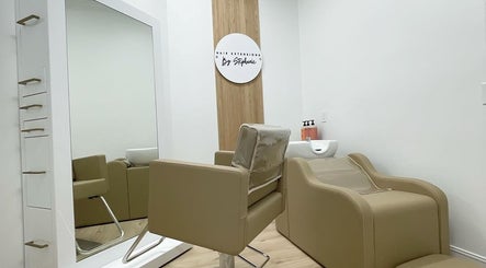 Chic salon interior at Hair Extensions by Stephanie in Bonita Springs, Florida featuring modern styling chair and mirror.