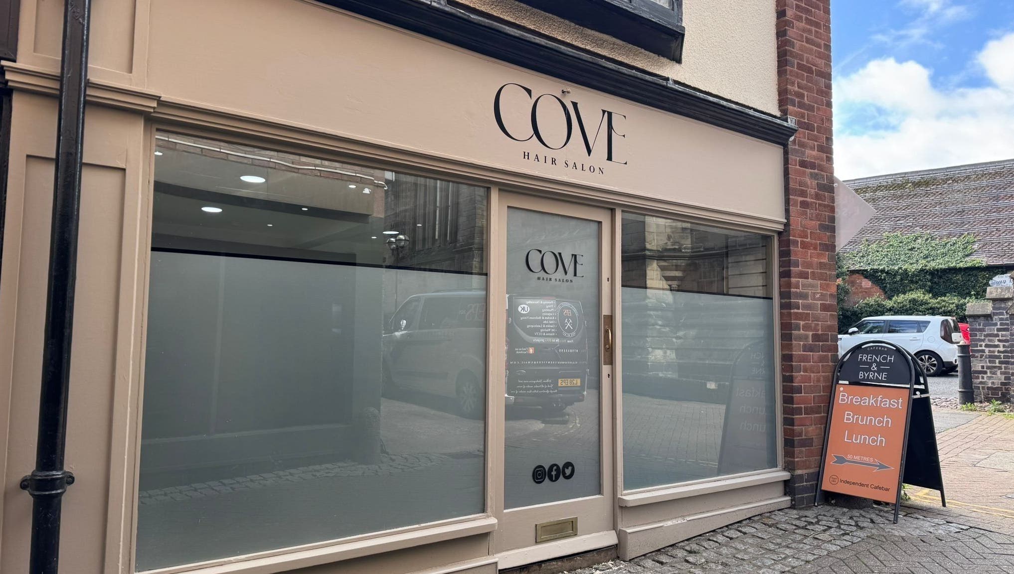 Elegant frontage of Cove Hair Salon in Stafford, England, GB, showcasing its inviting entrance.