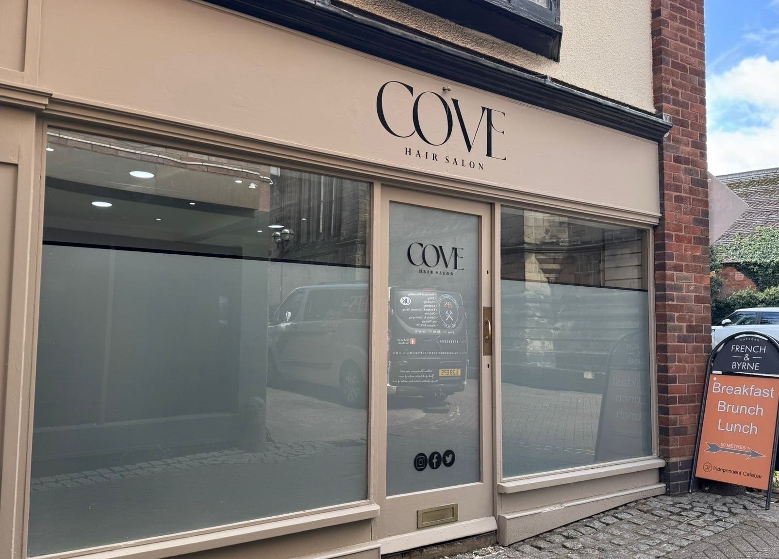 Elegant frontage of Cove Hair Salon in Stafford, England, GB, showcasing its inviting entrance.