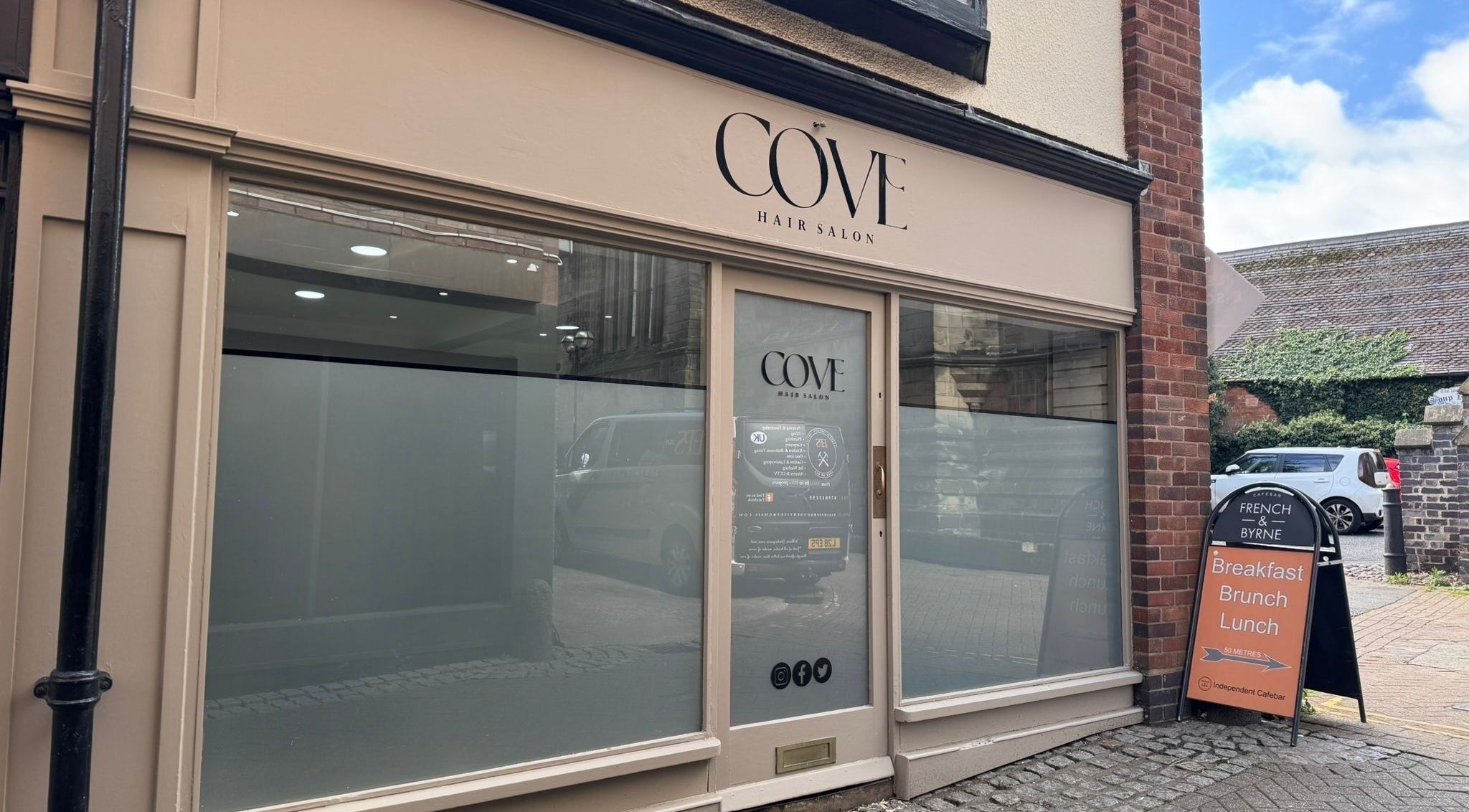 Elegant frontage of Cove Hair Salon in Stafford, England, GB, showcasing its inviting entrance.
