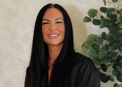 A smiling professional from Xtreme Beauty (Mobile Therapist), Ponteland, England, GB, with lush greenery background.